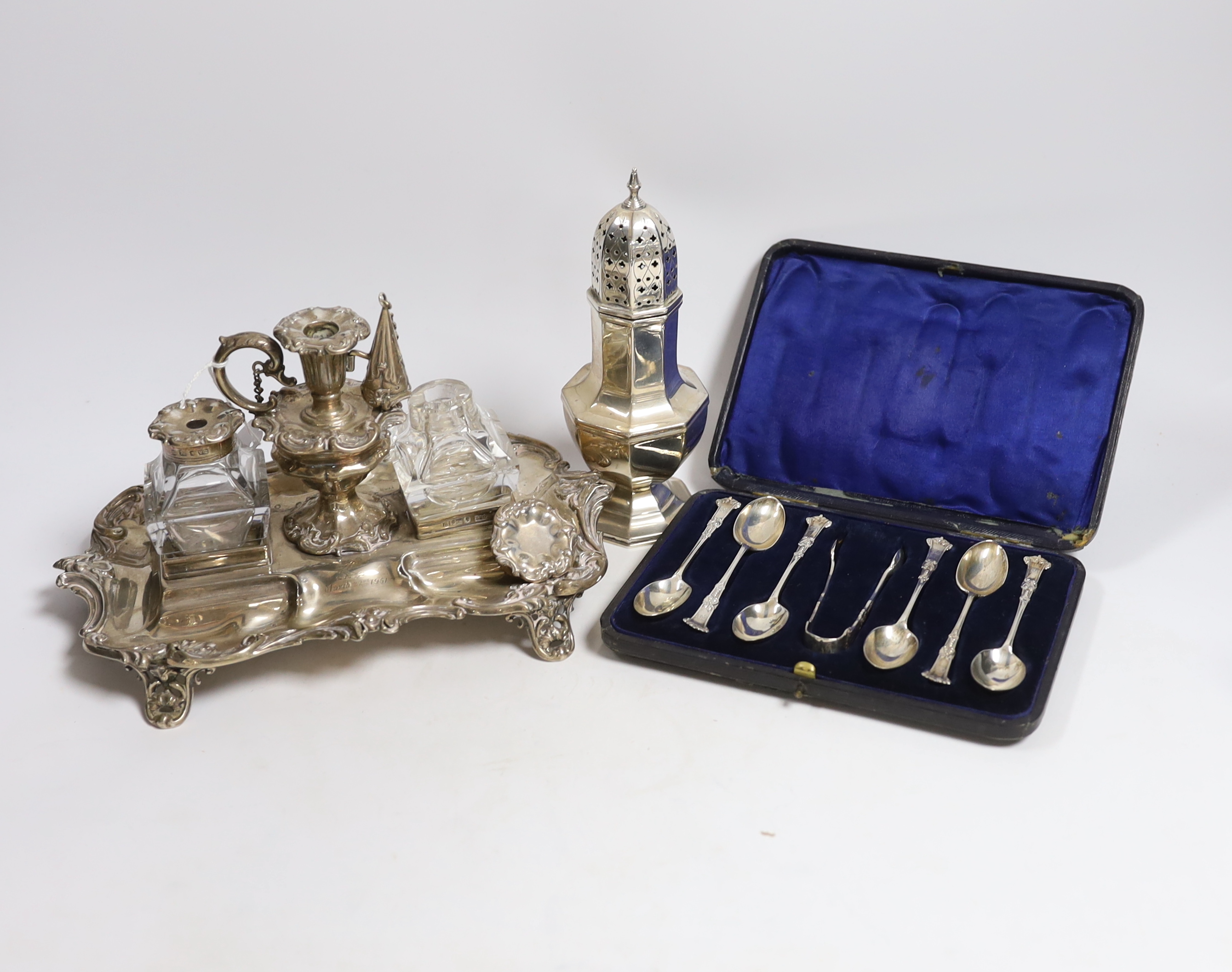 A Victorian silver inkstand, with two mounted glass wells and removeable taper stick, Henry Wilkinson & Co Ltd, Sheffield, 1841, 24.5cm, 15.5oz, together with a silver sugar caster and cased set of six silver teaspoons w